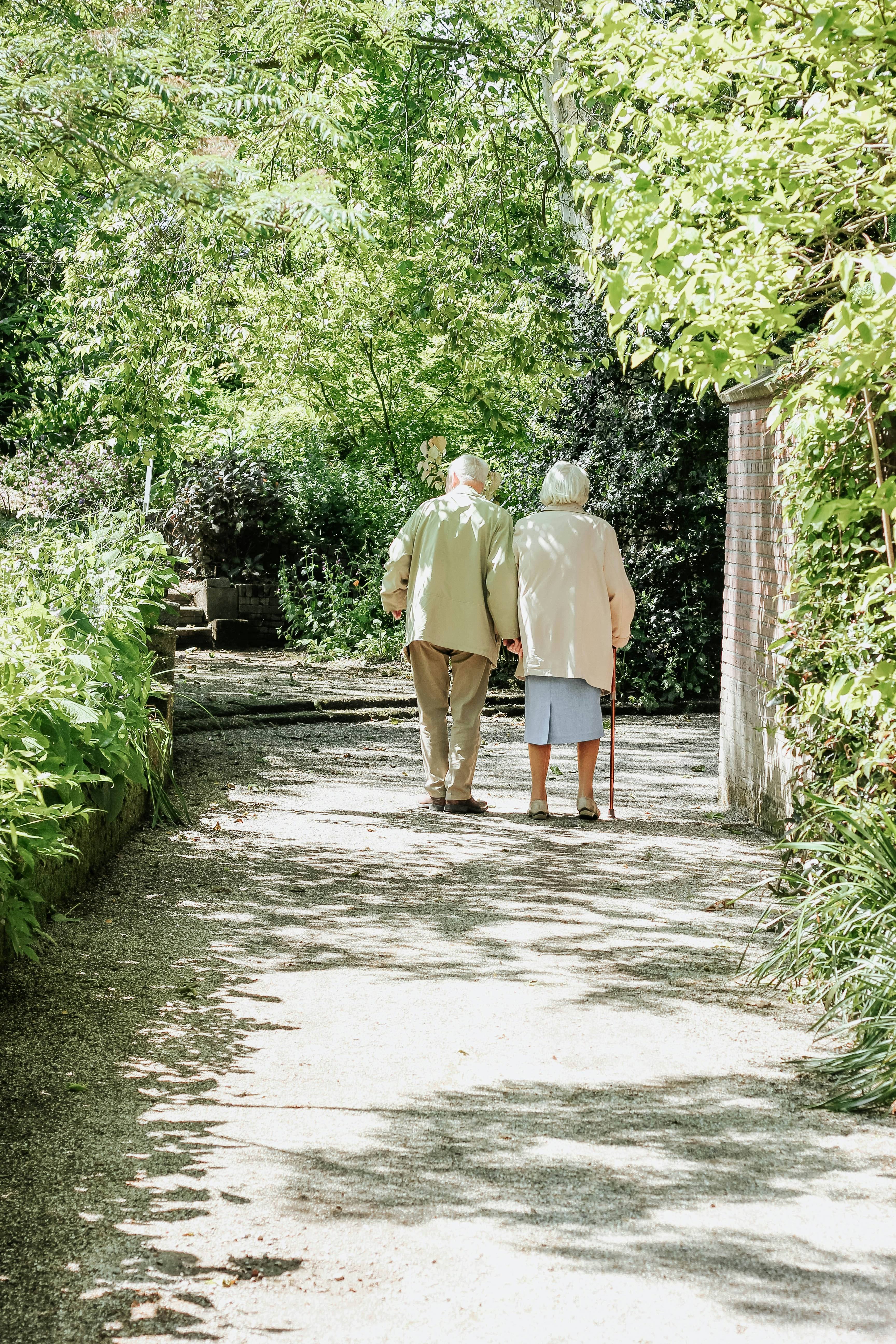 Elderly couple taking active steps for better health by walking together